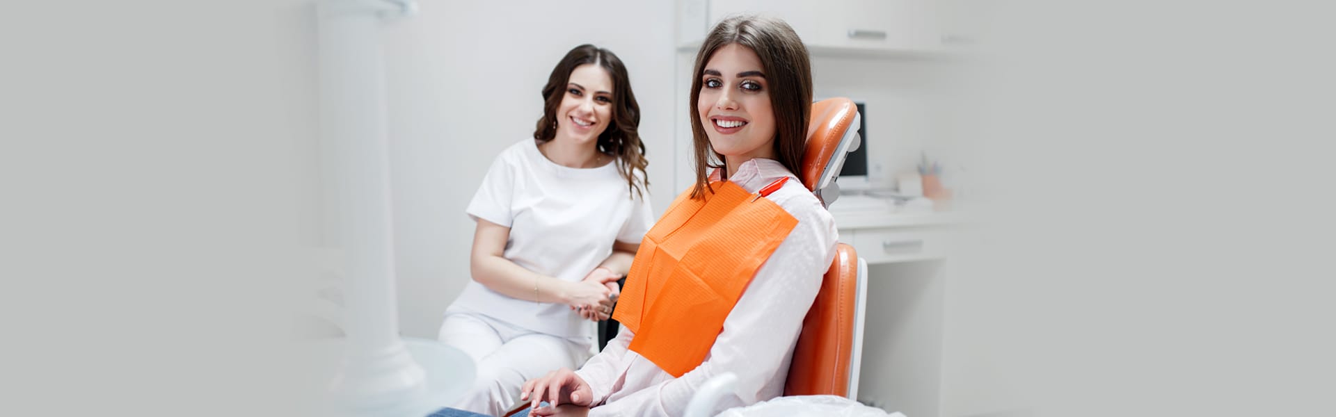 Smiling Woman During a Dental Cleaning Procedure