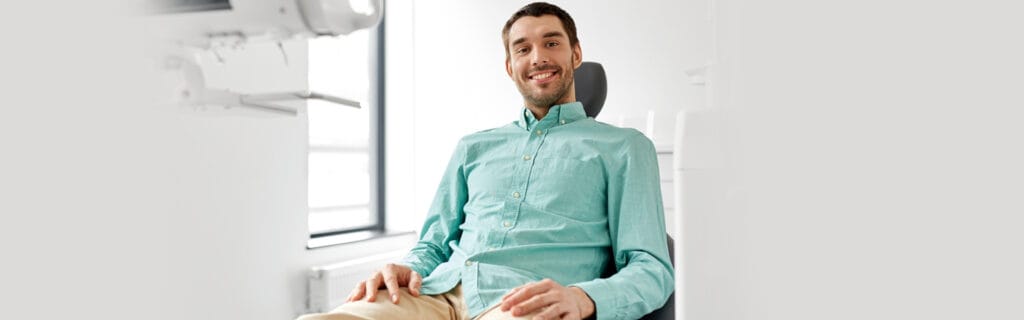 Oral sedation basics what you need to know about sedation dentistry in richmond 1 Man in a light green shirt smiling during a dental appointment