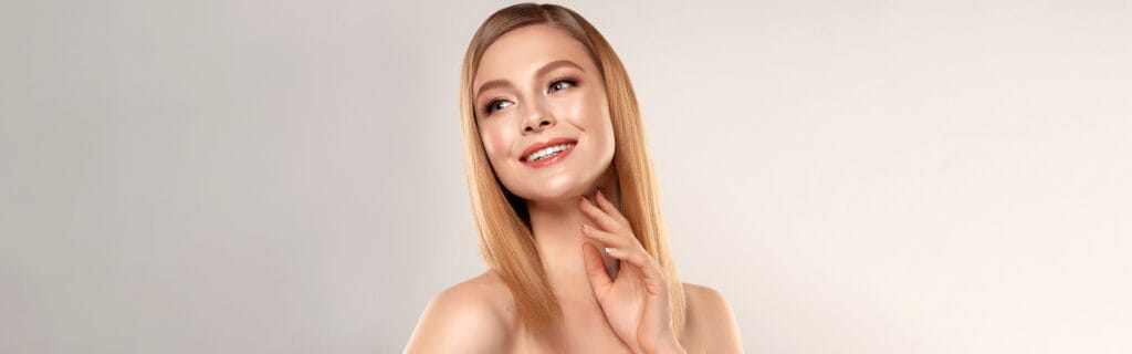 Woman with bright smile after teeth whitening treatment