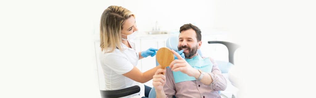Patient reviewing dental veneers treatment results with the dentist