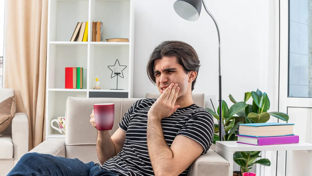 How do cavities and gum disease develop without pain?